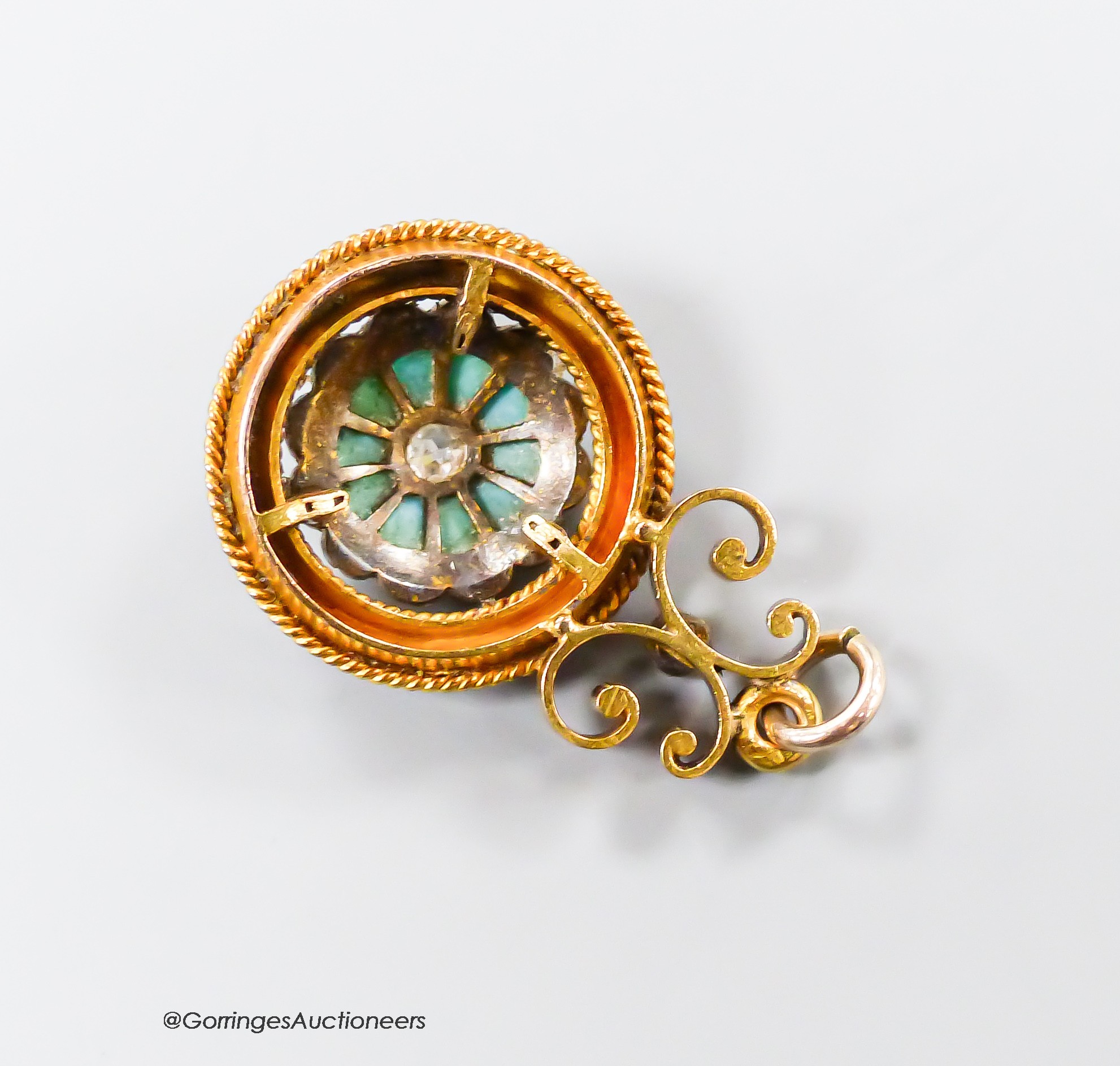 A Victorian yellow metal, turquoise and rose cut diamond set 'wheel' pendant, 16mm, gross weight 3.9 grams.